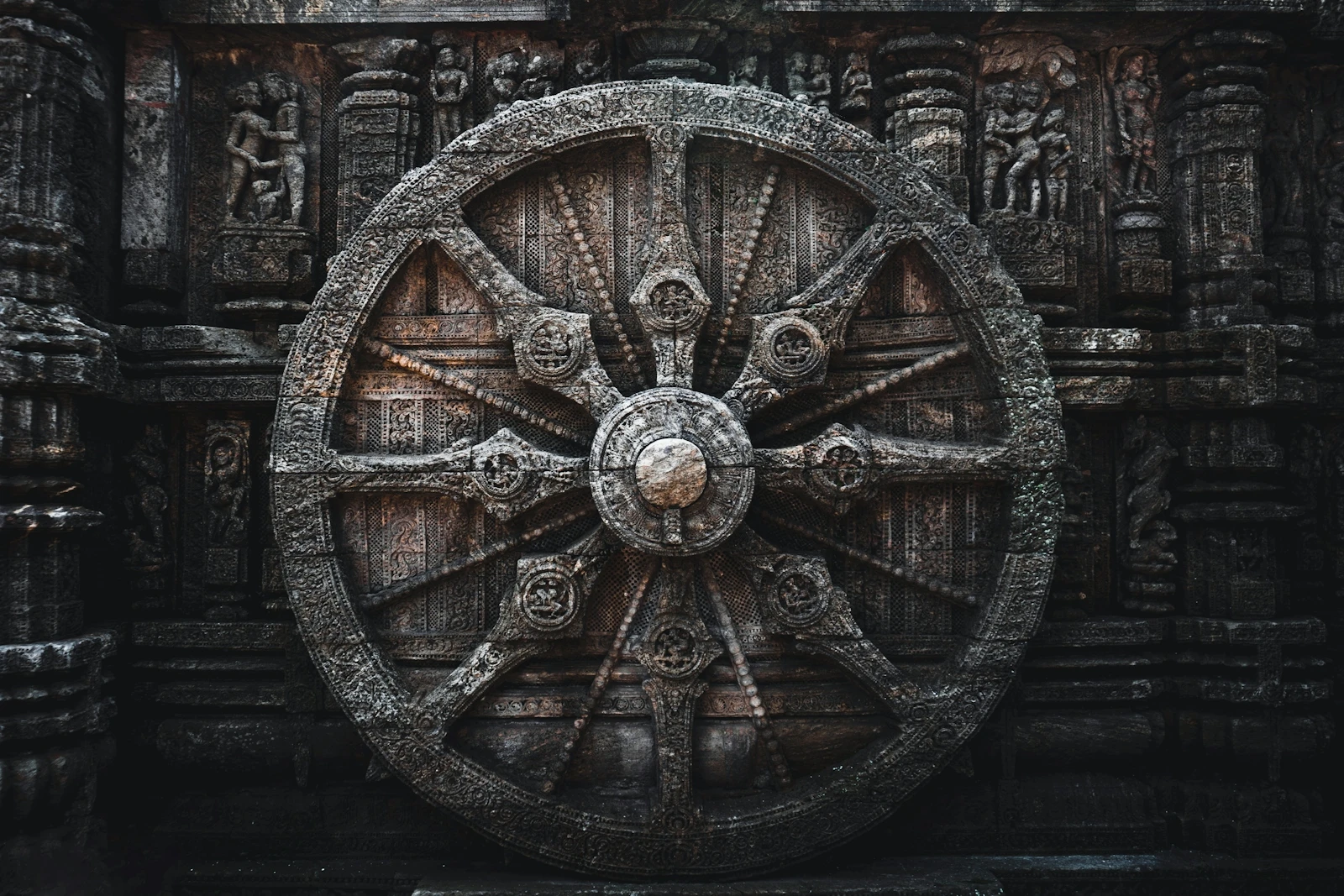 A giant carved stone wheel of the Sun Temple at Konark, Odisha, its spokes and hub worked in relief
