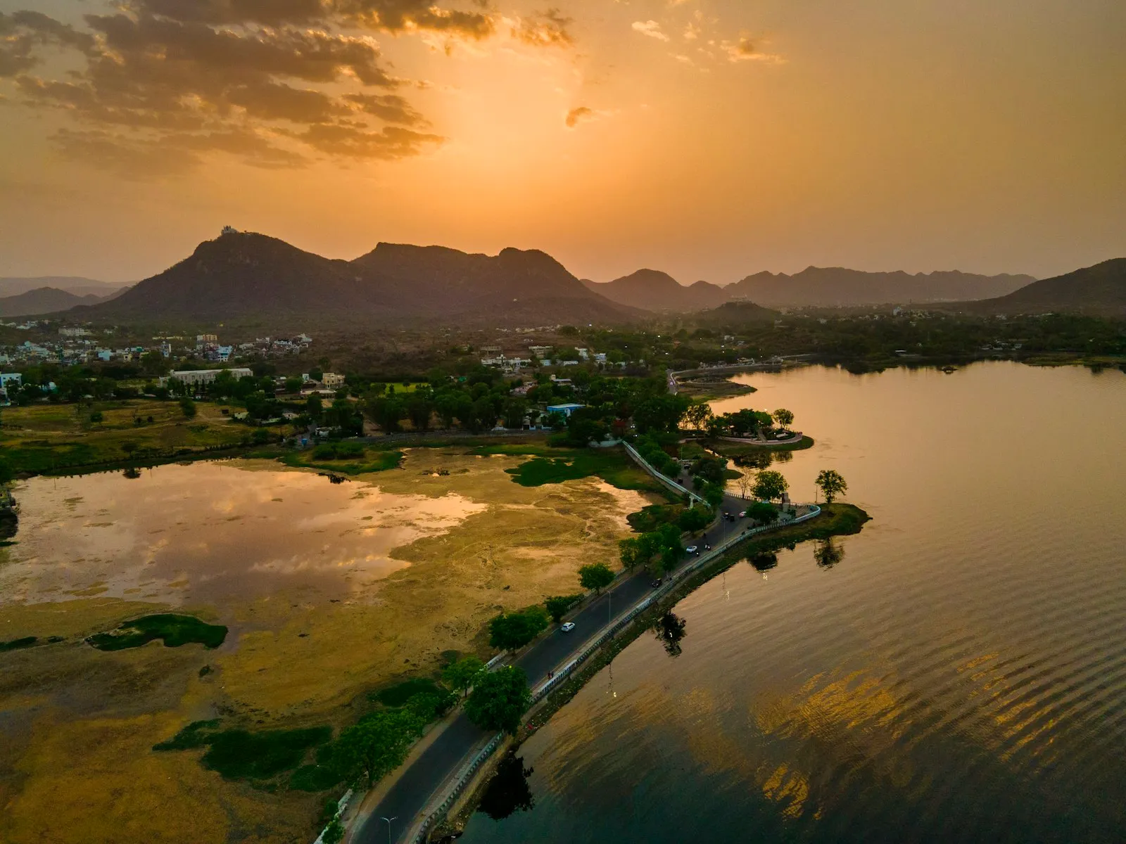 Udaipur's lakeside old city rising from the water, with palaces and havelis along the shore