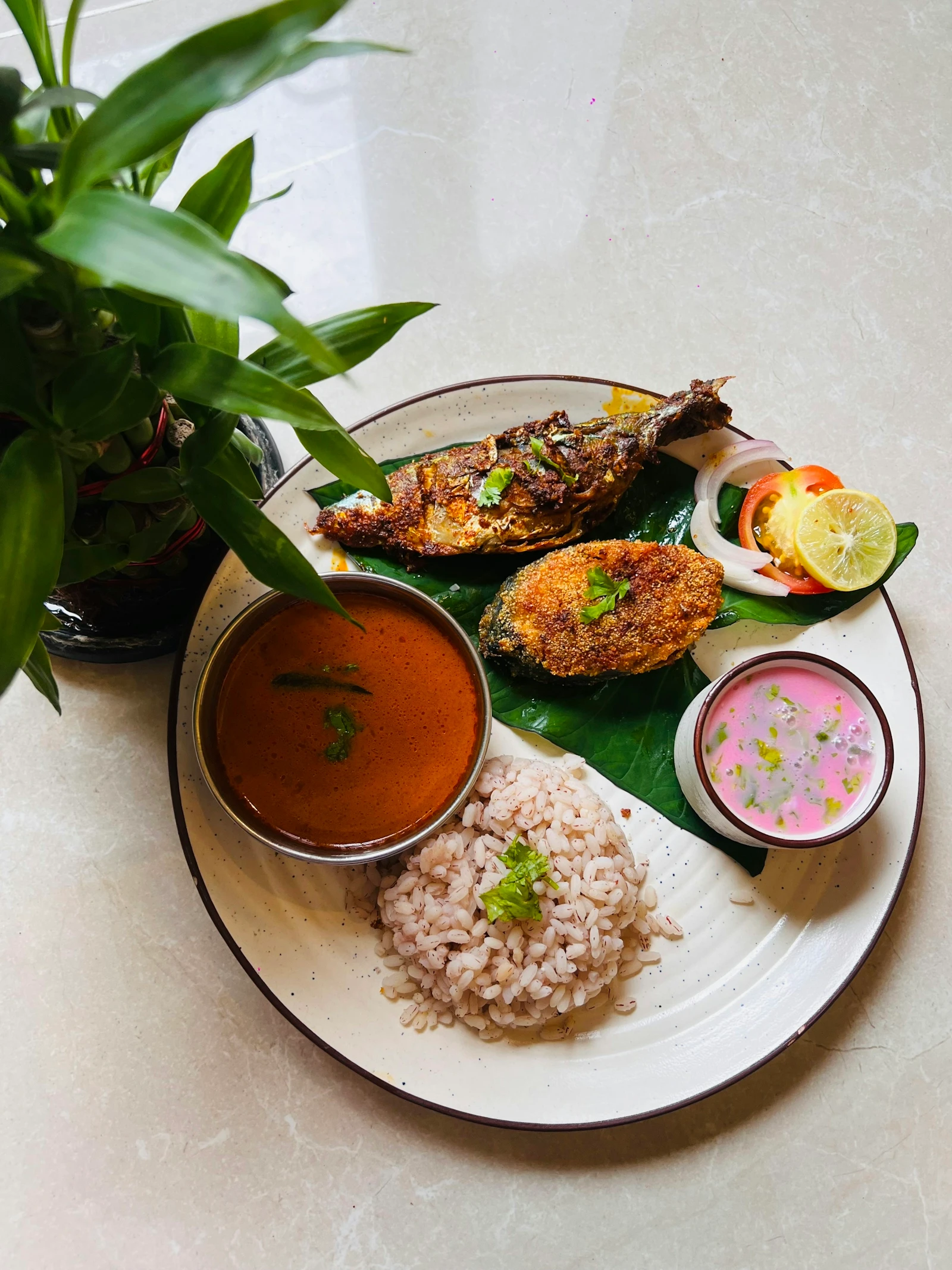 A South Indian fish curry served with rice in the Kerala coastal style